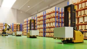 Autonomous warehouse robots in a modern logistics facility for efficient inventory management and cargo handling.