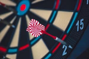 High-quality image of a dart hitting the bullseye on a dartboard, symbolizing precision and accuracy in logistics and supply chain services offered by China Vast Logistics.