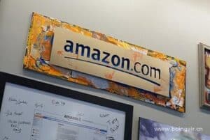 Brightly painted Amazon.com logo on a signboard at China Vast Logistics, highlighting international e-commerce logistics services.