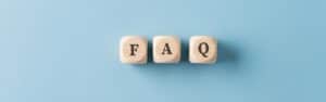 Faq wooden blocks on light blue background representing China Vast Logistics FAQ section for logistics and supply chain inquiries in China and international markets.