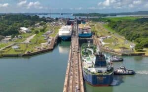 Container ships navigating the Panama Canal, a key logistics hub for global shipping and trade. Image showcases efficient maritime logistics, cargo transportation, and international freight services.