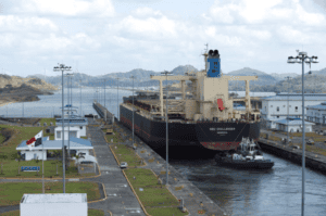 Large cargo ship NSU Challenger navigating through a Panama Canal lock, showcasing China Vast Logistics' global freight shipping and logistics services in international trade.