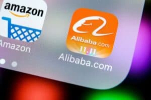 Alibaba.com logo on smartphone screen showcasing e-commerce and logistics platform.