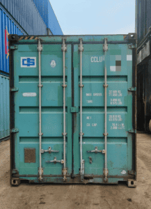 Shipping container at China Vast Logistics warehouse, ready for international freight services, featuring structural details and weight specifications.