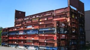 Intermodal freight containers stacked outdoors, showcasing China Vast Logistics shipping and freight forwarding services, emphasizing global transportation, shipping containers, and supply chain logistics.