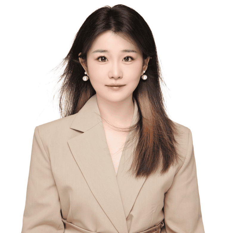 Professional headshot of Bliss, sales representative at Vastlog, wearing a beige blazer and pearl earrings, posed against a plain background
