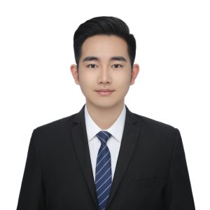 Professional headshot of Ryan Ren, sales representative at Vastlog, wearing a black suit, white shirt, and striped tie, posed against a plain background