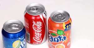 Coca-Cola, Fanta, and Sprite soda cans arranged with China Vast Logistics branding for efficient beverage shipping solutions.