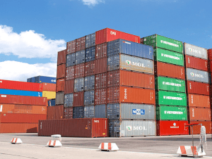 Stacks of shipping containers at a China Vast Logistics port facility, showcasing the company's expertise in international freight and logistics management.