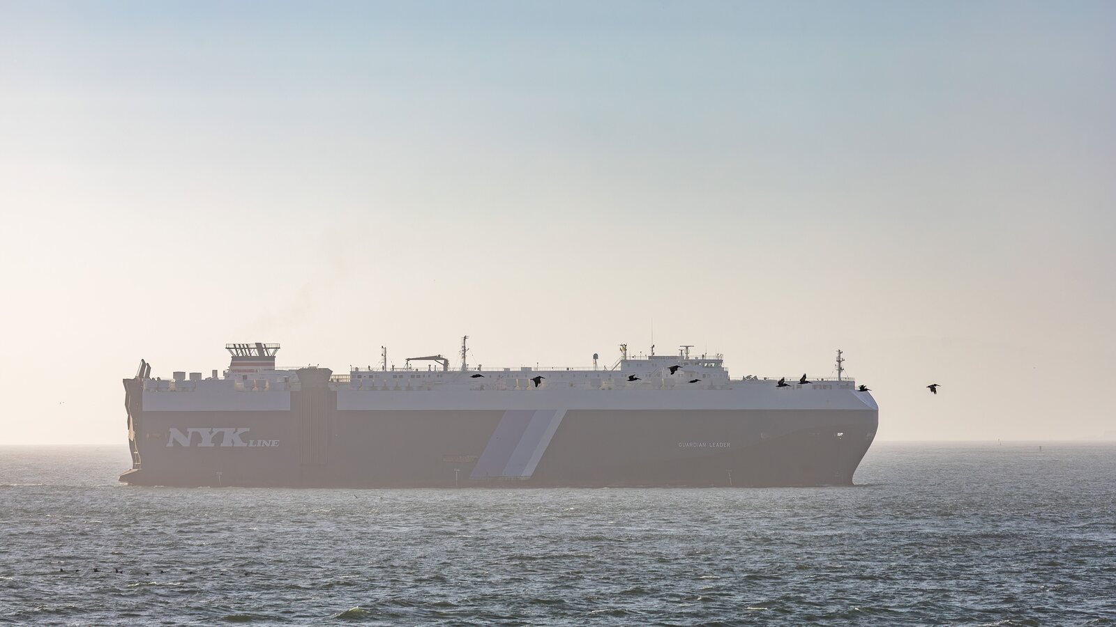 Cargo vessel sailing at sea, illustrating ocean freight departure and arrival milestones
